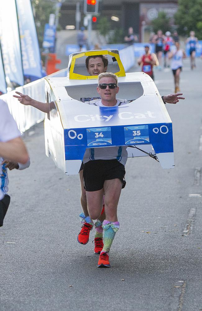 Sharn Byard and Luke Anderson dressed as a CityCat. Picture: Jerad Williams