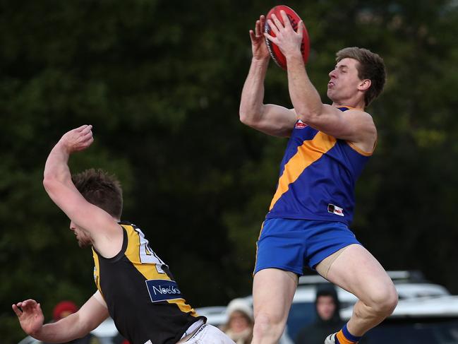 Lachlan Koger takes a mark for Lilydale. Picture: Hamish Blair