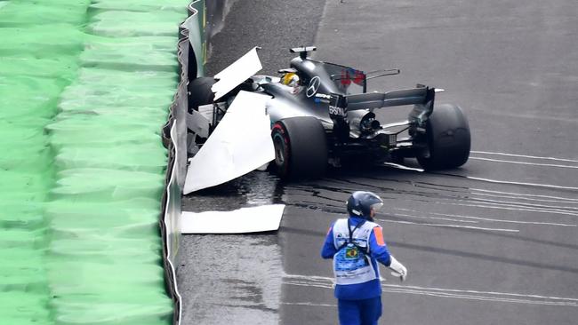 Mercedes’ British driver Lewis Hamilton sits in his car right after crashing in Sao Paulo.