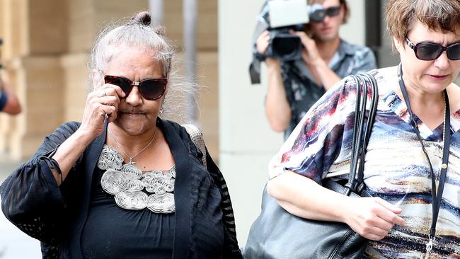 Ms Wilson-Rigney’s mother, and the children’s maternal grandmother, Donna Rigney, left, leaves court with a victim support officer. Picture: Dylan Coker