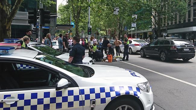 Onlookers came to the rescue of the wounded in the immediate aftermath. Picture: Luke Costin