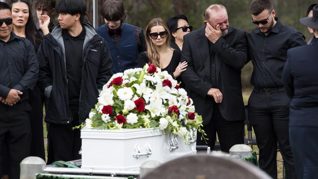 Grieving mourners surround the coffin. Picture: NCA NewsWire / Monique Harmer