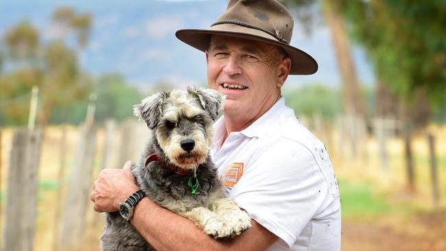 COUNTRY LIVING: Vets Beyond Borders Dr Graeme Blanch has been a vet in Wangaratta since 1982, specialising in horses but also working with small animals and cattle. He is a volunteer with Vets Beyond Borders, having worked in India to vaccinate and sterilise rabid dogs. He also volunteers in central Australia with remote indigenous communities. Pictured: Graeme with his Schnauzer named Edna. PICTURE: ZOE PHILLIPS