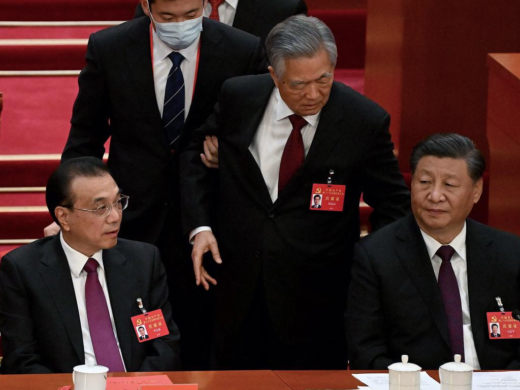 Former president Hu Jintao was escorted out. Picture: Noel Celis/AFP