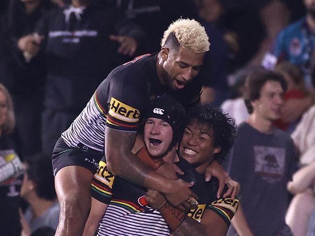 SYDNEY, AUSTRALIA - APRIL 09:  Matt Burton of the Panthers celebrates with team mates after scoring a try during the round five NRL match between the Penrith Panthers and the Canberra Raiders at BlueBet Stadium on April 09, 2021, in Sydney, Australia. (Photo by Mark Kolbe/Getty Images)