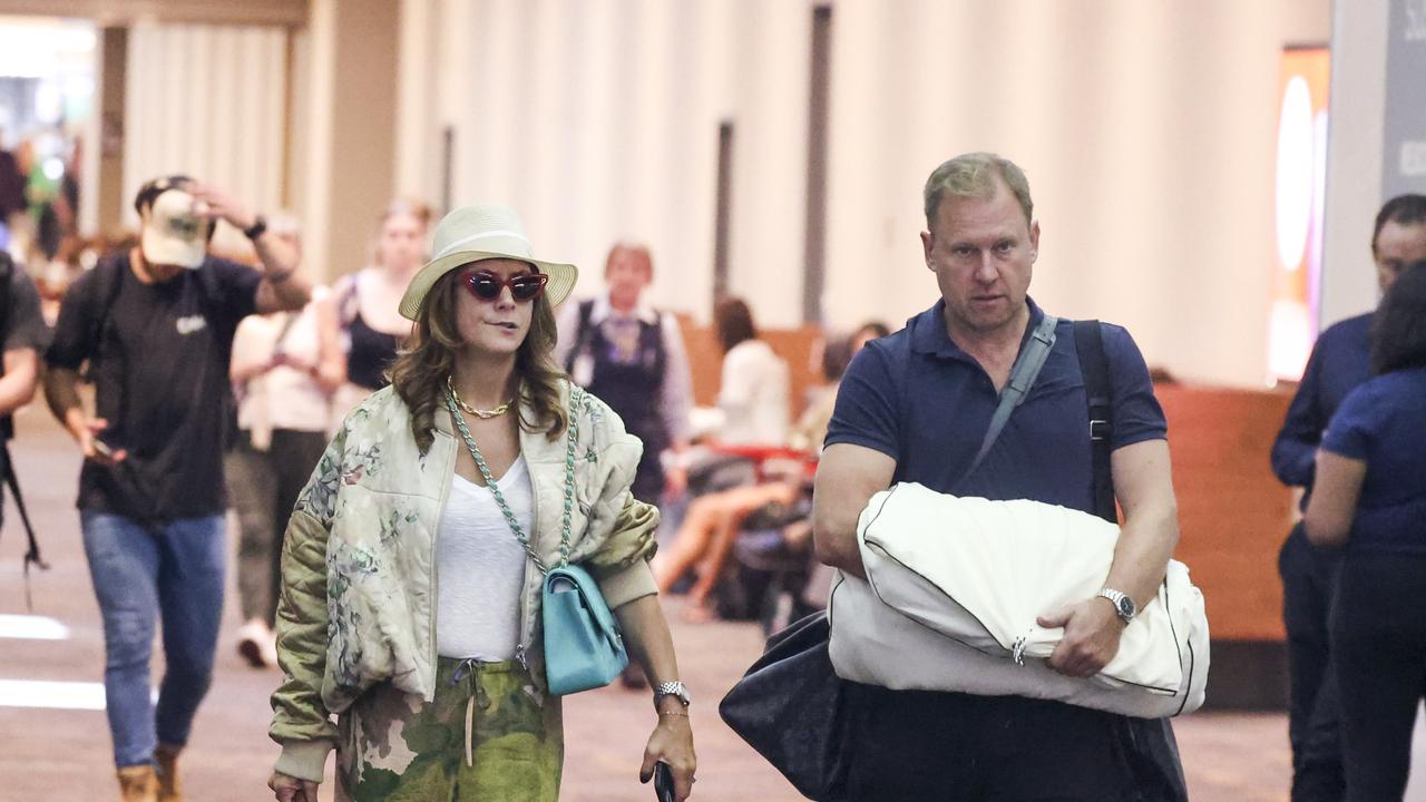 Hollywood star goes full glam at Melbourne Airport alongside Aussie beau
