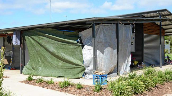 THIN VEIL: Tarpaulines act as a buffer to the bitter winds at Clewley Park off Water St where about 16 people sleep every night. Picture: Tara Miko