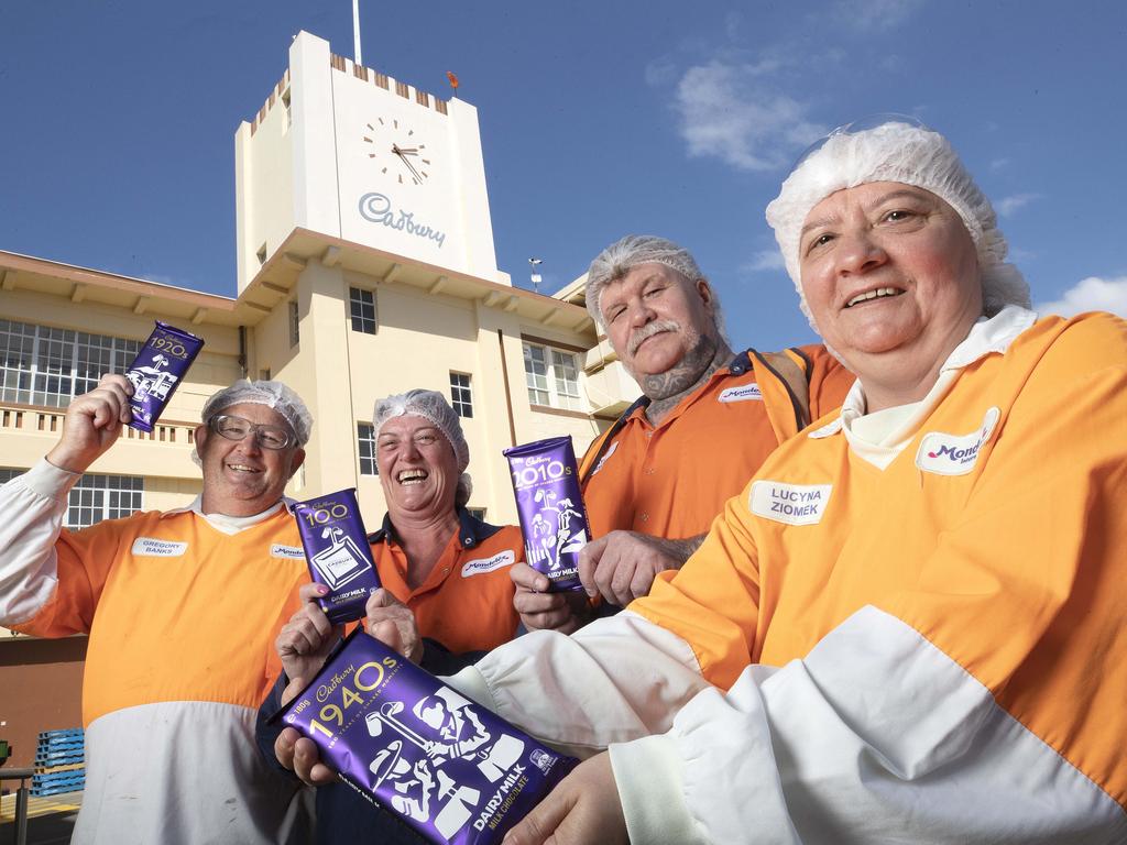 Cadbury staff members Greg Banks, Tracy Baker, Patrick Swan and Lucy Ziomek with special Dairy Milk block celebrating 100 years of the firm in Australia. Picture: Chris Kidd