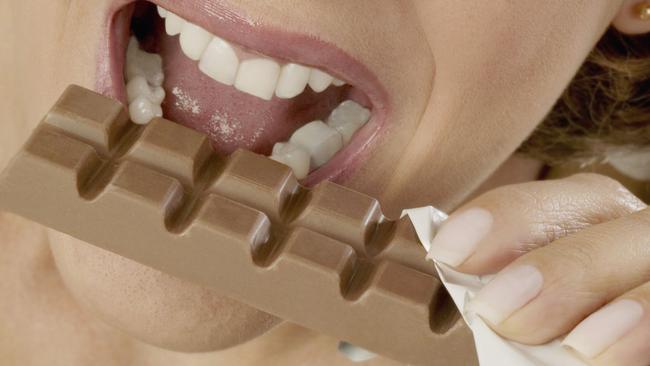 Nov 9: All Things Coffee and Chocolate: generic photo of woman eating chocolate bar (photo credit: ThinkStock)