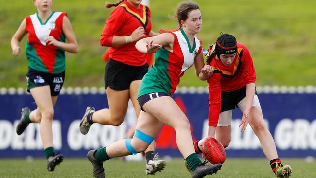 Ava Hauser of Clonard College and Sarah Burton of Ballarat Clarendon College compete for the ball. Picture: Dylan Burns/AFL Photos via Getty Images