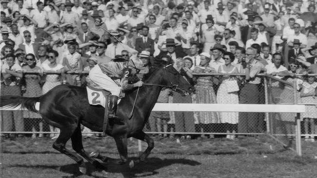 Straight Flight ridden by jockey Bill Pyers in the lead with 20 yards to go before easily winning the Balhannah Handicap race at Oakbank racecourse on April 4, 1958.