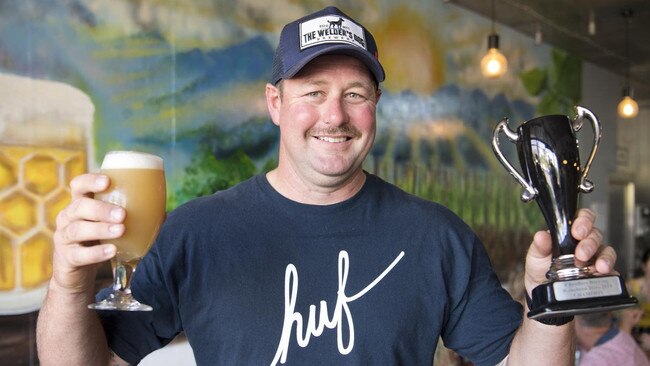 CHEERS: Tony Brand with his Four Fires Pale Ale at the Homebrew Heroes brewing competition in Toowoomba. Picture Picture: Nev Madsen. .