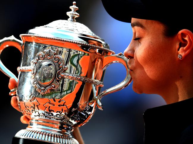 Ash Barty of Australia kisses the French Open trophy at Roland Garros.