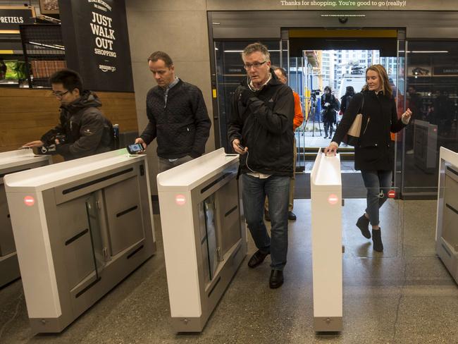 Shoppers scan the Amazon Go app on the mobile devices as the enter the Amazon Go store in Seattle, Washington. Picture: Stephen Brashear