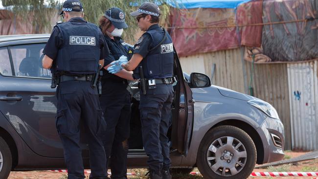 Police inspect the car Mr Veleski was allegedly driving. Photo: Jeff Tan