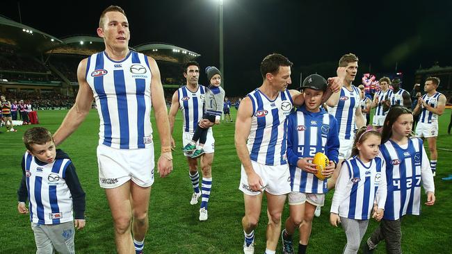 Drew Petrie, Michael Firrito, Brent Harvey and Nick Dal Santo get a guard of honour.