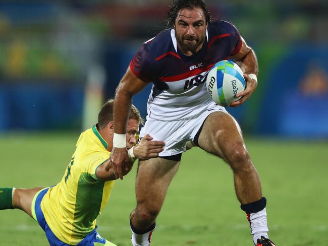 RIO DE JANEIRO, BRAZIL - AUGUST 09: Nate Ebner of the United States beats Felipe Claro of Brazil to score a try during the Men's Rugby Sevens Pool A match between the United States and Brazil on Day 4 of the Rio 2016 Olympic Games at Deodoro Stadium on August 9, 2016 in Rio de Janeiro, Brazil. (Photo by David Rogers/Getty Images)