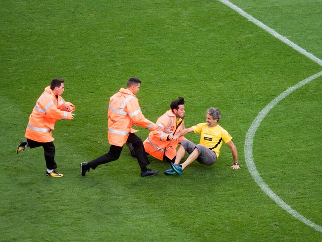 A pro-independence protester jumps onto the pitch during the match. Picture: Alex Caparros/Getty Images