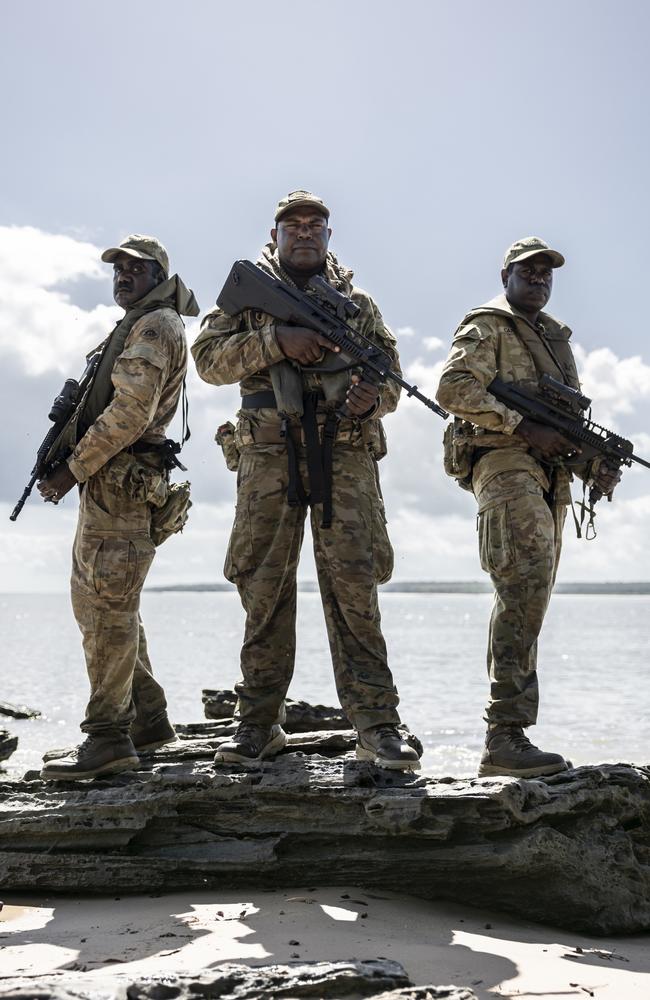 Norforce Darwin Squadron Private Peter Puruntatameri, Private Misman Kris and Private Blake Djammarr Carter on the beach of Milikapiti, Tiwi Islands. Picture: Dylan Robinson