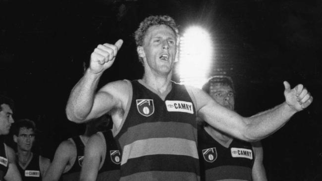 Robbie Thompson and the Crows celebrate their first official win as an AFL team.