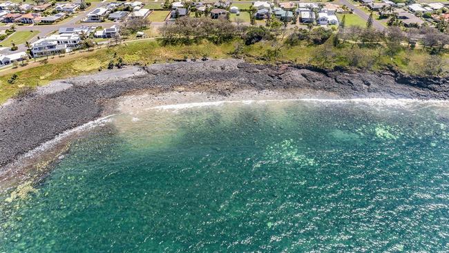 Coral bleaching has been witnessed even by those simply trying to sell houses, with bleached coral visible in a fly-over shot taken at Coral Cove by R&amp;W Real Estate Bundaberg Bargara. Image credit: Right Image Photography.