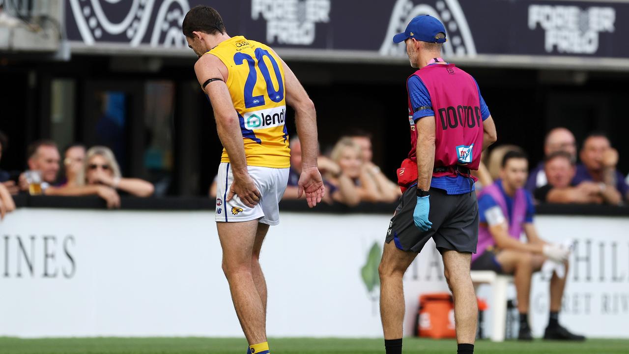 PERTH, AUSTRALIA - APRIL 02: Jeremy McGovern of the Eagles is assisted off the field with a possible hamstring injury during the 2023 AFL Round 03 match between the Fremantle Dockers and the West Coast Eagles at Optus Stadium on April 2, 2023 in Perth, Australia. (Photo by Will Russell/AFL Photos via Getty Images)