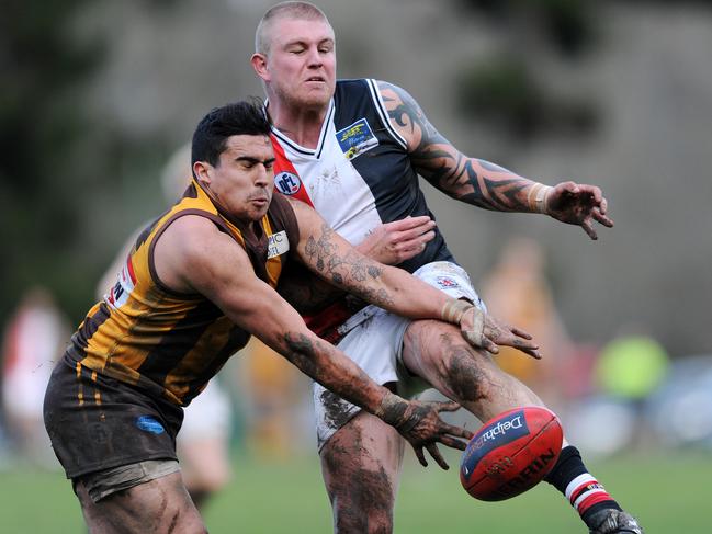 NFL Footy: Heidelberg West v Watsonia 12 July 2014, Heidelberg Northern Football League: Heidelberg West v Watsonia at Heidelberg Park. Watsonia's Steven Goodwin under pressure. Picture: Eugene Hyland