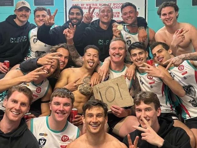 Nathan Gardiner celebrates his 100-goal milestone with his Cora Lynn teammates. Picture: Facebook