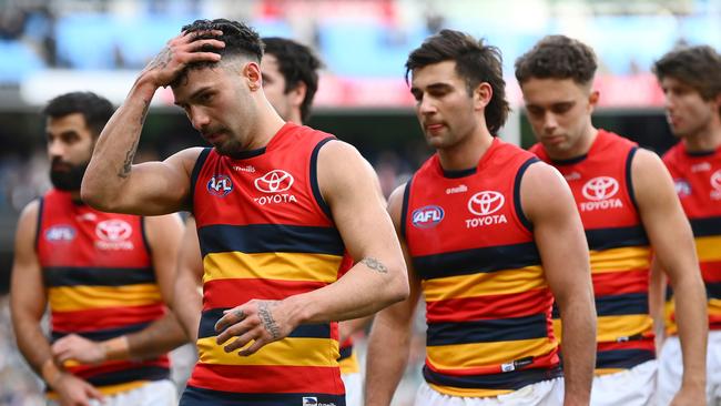 The Crows dejected after losing to Collingwood. Picture: Getty