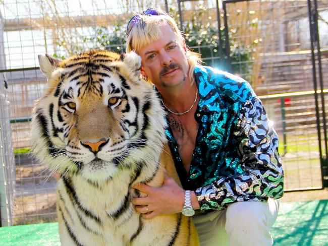 Joseph "Joe Exotic" Maldonado-Passage with one of his tigers. (Photo by – / Netflix US / AFP)