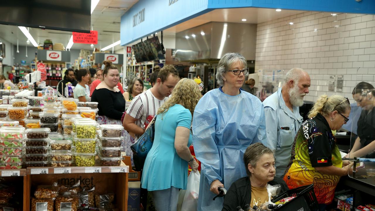 Kempsey residents line up for supplies at the IGA … the only supermarket left open in the town. Picture: Nathan Edwards