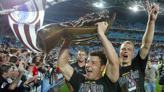 Luke Lewis (right) and Craig Gower celebrate Penrith’s 2003 premiership victory.