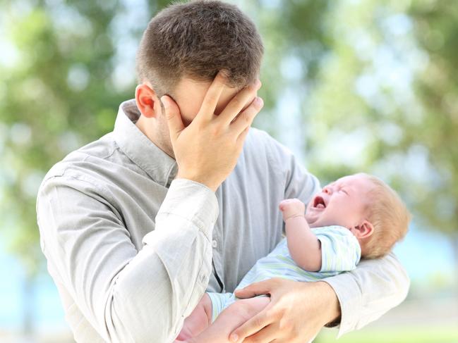 Worried father and baby crying