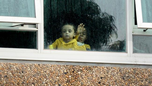 Children isolated inside a public housing tower at Flemington. Picture: Andrew Henshaw