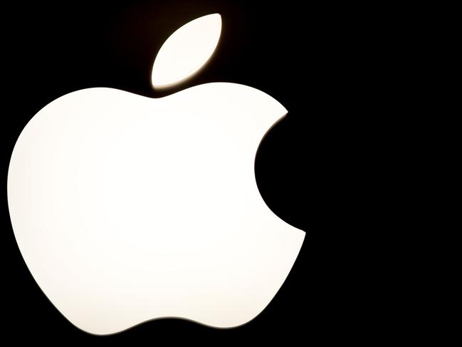 (FILES): This November 26, 2010 file photo shows the logo for Apple at a store in Tysons Corner, Virginia. In its bid to become a power in music streaming, Apple is devoting its vast resources to create what it hopes will be a first truly global radio station. The $750 billion company, whose iTunes revolutionized how disparate parts of the world buy music, on July 1, 2015 launches Apple Music as it sees consumer trends shift to streaming, which allows on-demand unlimited content online. AFP PHOTO / FILES / Karen BLEIER