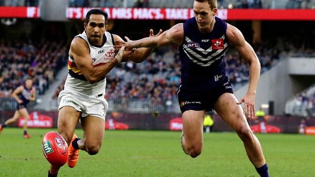 Crows Eddie Betts and Fremantle’s Ryan Nyhuis chase the ball at Optus Stadium on Sunday in Perth, Australia. (Picture: Will Russell/Getty