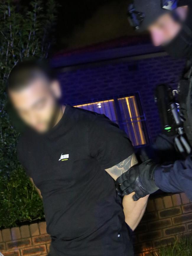 One of the men being arrested in Campsie. Picture: NSW Police