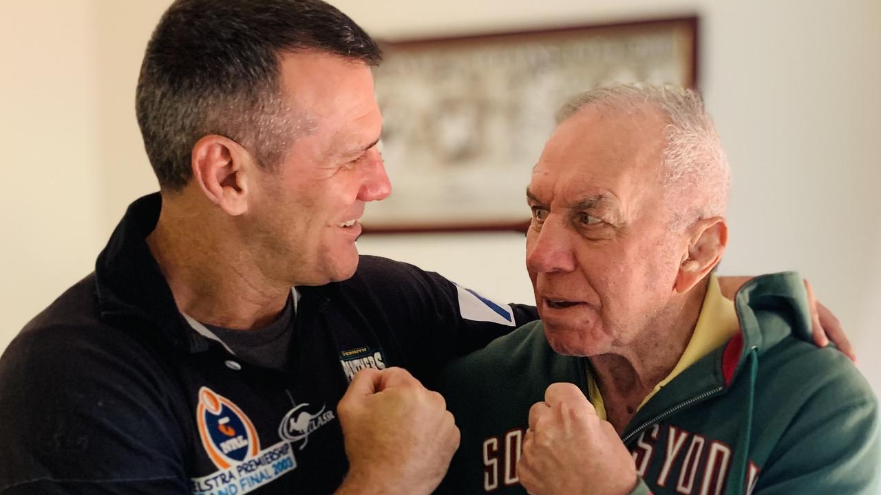 Son Scott hams it up with rugby league icon and father John, who famously skippered South Sydney to four premierships.