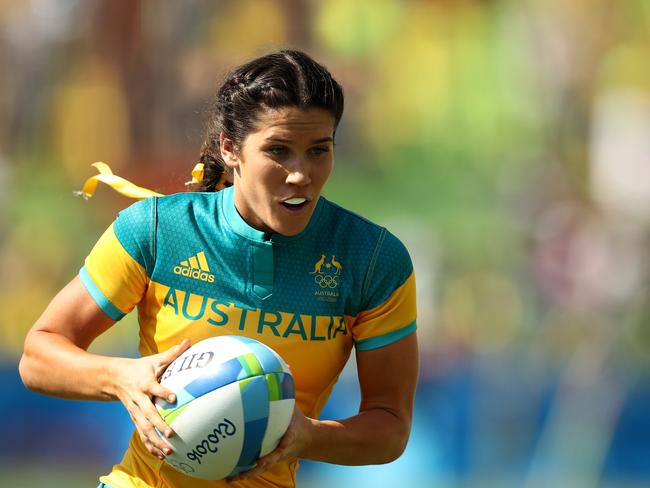 RIO DE JANEIRO, BRAZIL - AUGUST 06: Charlotte Caslick of Australia runs with the ball during the Women's Pool A rugby match between Ausutralia and Colombia on Day 1 of the Rio 2016 Olympic Games at Deodoro Stadium on August 6, 2016 in Rio de Janeiro, Brazil. (Photo by Mark Kolbe/Getty Images)