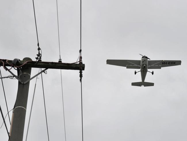 An aircraft during landing approach at Moorabbin Airport during gale force north-westerly winds in August.