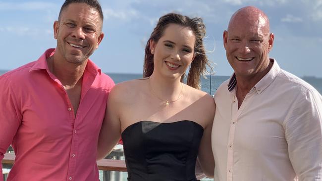 Anthony (R) and Chris (L) with their 18-year-old daughter, Grace. Picture: Supplied