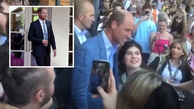 Prince William gets rock star treatment while Prince Harry cuts a stark figure.