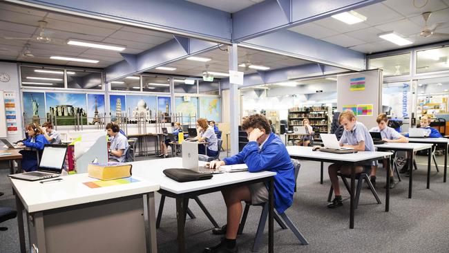 Students at Redcliffe State High School are all learning online whether they are in the classroom or studying at home. PHOTO: AAP /Attila Csaszar