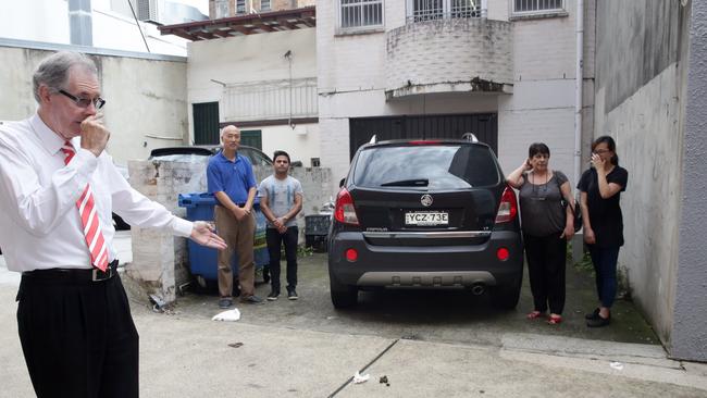 Tim Simpson, Jack Chen, Sadat Adhikari, the Inner West Council’s Julie Passas and Rita Lin are fed up with people defecating in the alleyway. Picture: Craig Wilson