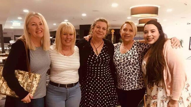 Robyn Munro (centre) with her friends at the Palm Beach Surf Club during her farewell party last month.