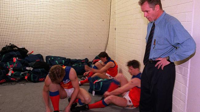 Coach Alan McConnell with players in the rooms at Subiaco Oval after Fitzroy’s last game – an 86-point loss to Fremantle.