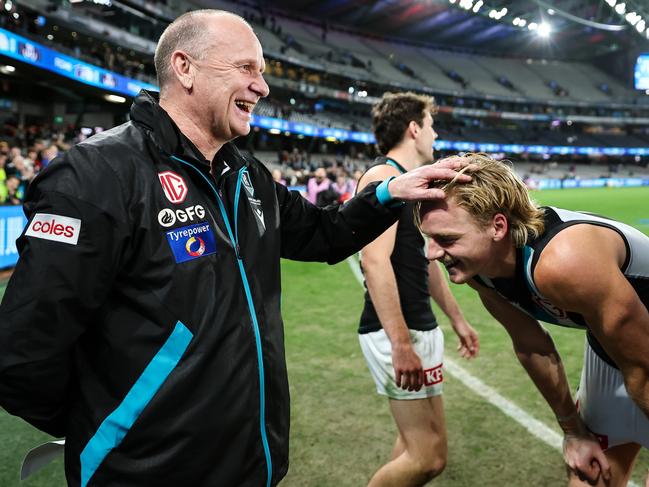 MELBOURNE, AUSTRALIA - JUNE 09: Ken Hinkley, Senior Coach of the Power celebrates with Miles Bergman of the Power during the 2023 AFL Round 13 match between the Western Bulldogs and the Port Adelaide Power at Marvel Stadium on June 9, 2023 in Melbourne, Australia. (Photo by Dylan Burns/AFL Photos via Getty Images)