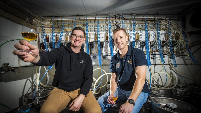 Tyler Clark from 7K distillery has teamed up with Custom's House Hotel's Rob Jubb to use all their wasted keg beer by transforming it into a whiskey. Picture: LUKE BOWDEN