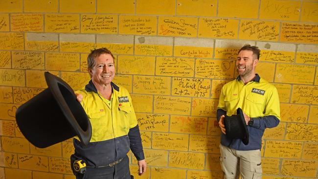 JRCM joiners Stewart Lally and Andy Liverton in front of the rebuilt signature wall. Picture: Tom Huntley