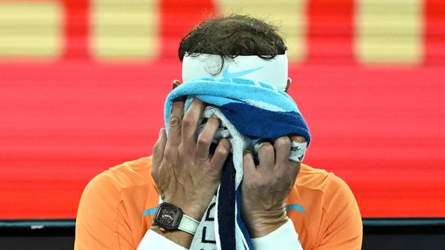 Spain's Rafael Nadal takes rest during the break in his men's singles